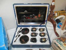 A boxed Chinese laquerware teaset