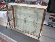 A retro glass display cabinet