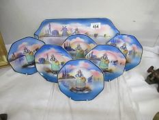 A collection plates featuring a Dutch lady and Dutch scene