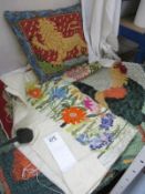 A collection of material items and tapestry pillow