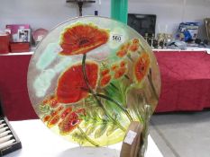 A nice art glass charger featuring poppies