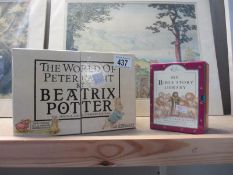 A boxed set of The World of Beatrix Potter books etc