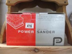 A boxed power sander