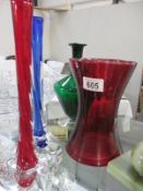 A collection of coloured glass items