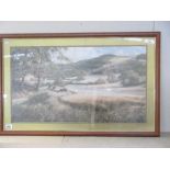 A large framed and glazed print of a countryside scene