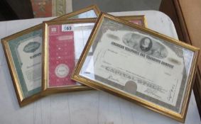 Three framed and glazed vintage share certificates