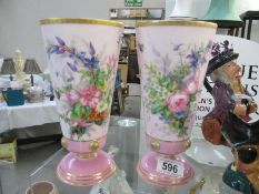 A pair of painted vases
