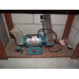 A Clarke 6" bench grinder with sanding belt.