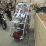 A Shop rider mobility scooter with weather canopy.