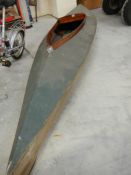 An early mahogany framed fabric skinned canoe.