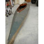 An early mahogany framed fabric skinned canoe.