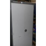 A metal 2 door cabinet.