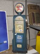 A model of a petrol pump clock cabinet.