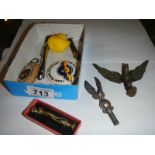 A mixed lot including brass eagles, Hillman key ring, tyre gauge etc.