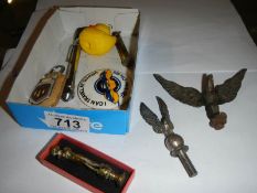 A mixed lot including brass eagles, Hillman key ring, tyre gauge etc.