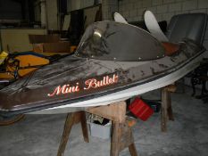 A 1970's Apollo mini bullet speedboat with outboard motor, water ski's etc.