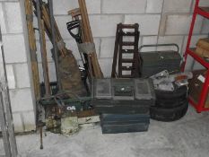 A mixed lot including ramps, winch, tool boxes, large bench vice etc.