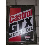 A retro Castrol GTX motor oil sign in old wooden frame.