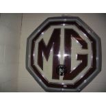 A large MG dealership illuminating showroom sign a/f.