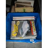 A box of 1990's Classic Car magazines and a box of 1950's handbooks including Alvis TA-14,