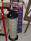 A Sealey oil and fluid extractor, model No. TP69 and one other.