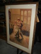 A large framed and glazed print of an Edwardian lady on bicycle.