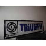 A large 1970's Leyland Triumph plastic dealer light board sign panel, a/f.