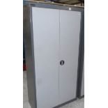 A metal 2 door cabinet.