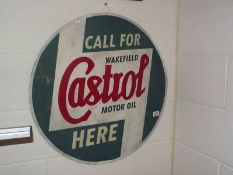 A painted Castrol motor oil metal sign.