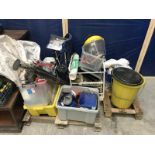 A pallett of miscellaneous items including safety equipment, drain rods, ratchet strap,