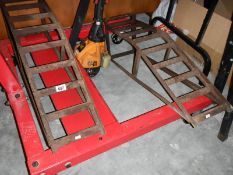 A pair of car inspection ramps.