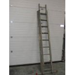 A triple extending aluminium ladder.