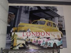 A large print on canvas of a New York yellow taxi cab and one other.