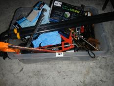 A box of old tools including jack saws, roof bars etc.