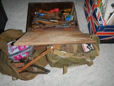 A wooden box and 2 canvas bags of spanners and other tools.