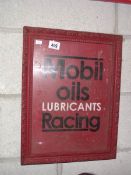 A retro Mobil Oils Lubricating Racing metal sign in old wooden frame.