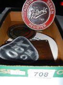 An Austin Seven fabric register car badge and other Austin Seven items.