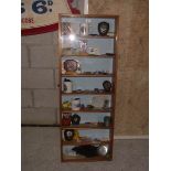 An oak display cabinet of 1980's motor sport memorabilia including trophies, competition licences,