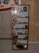 An oak display cabinet of 1980's motor sport memorabilia including trophies, competition licences,