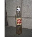 A Shell X-100 motor oil glass bottle.