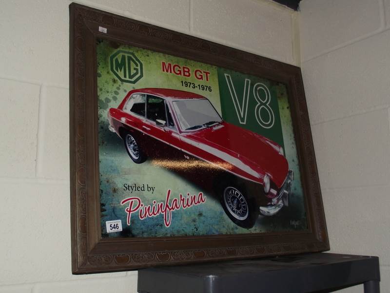 A retro MGB GT V8 metal sign in an old wooden frame.