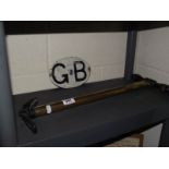 A GB AA plaque and a brass King Dick stirrup tyre pump.