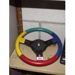 A mounting 13" Harlequin steering wheel with boss.