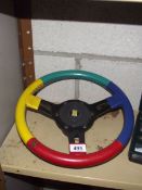 A mounting 13" Harlequin steering wheel with boss.