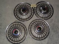 A set of 4 13" Ford Capri wheel trim hub caps.