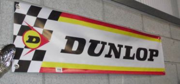 A retro Dunlop advertising banner.