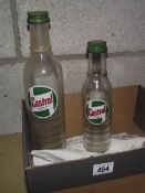 2 glass Castrol XL and XXL oil bottles.