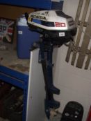 A Honda 20 outboard motor.