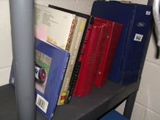 A shelf of books on motoring.