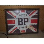 A retro BP motor spirit sign in old frame.